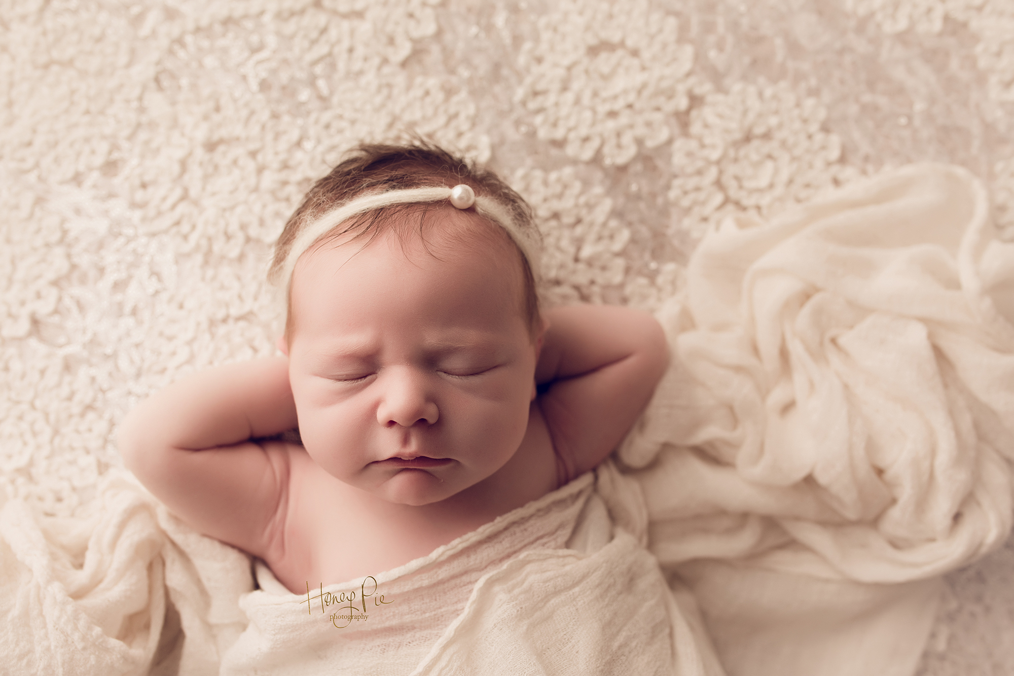 Newborn baby girl relaxing during her Brighton Newborn Photoshoot