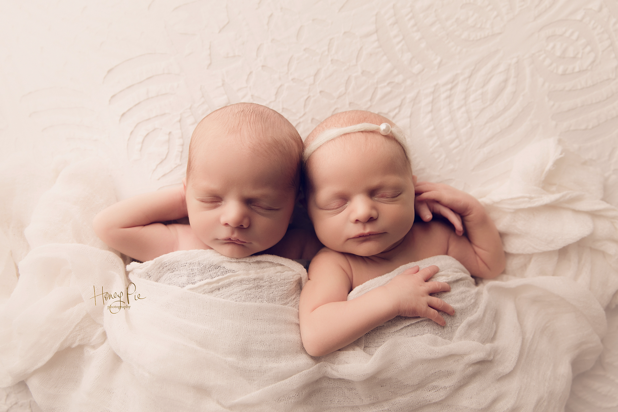 Twins cuddled up together & sleeping during their photography session