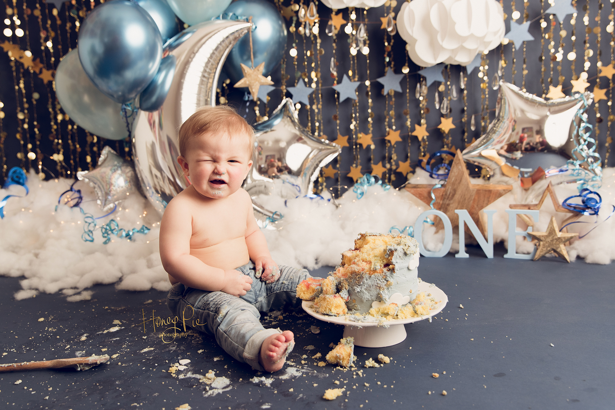 When the sugar hits, baby boy enjoying his birthday cake during photoshoot
