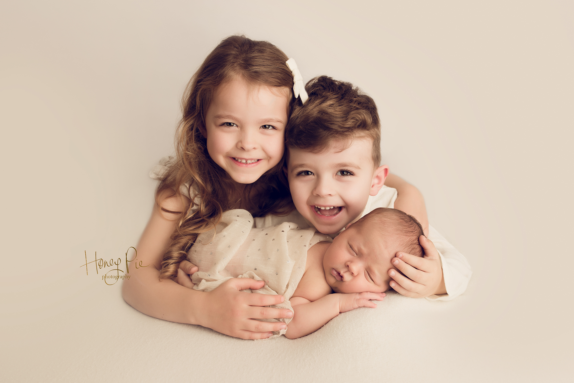 Sibling love with baby brother during newborn photoshoot